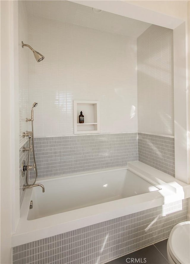 bathroom featuring tile patterned floors and toilet