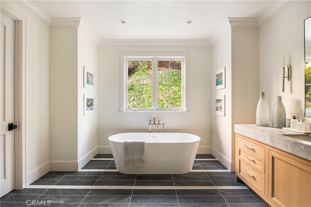 bathroom featuring vanity, a bathtub, and ornamental molding