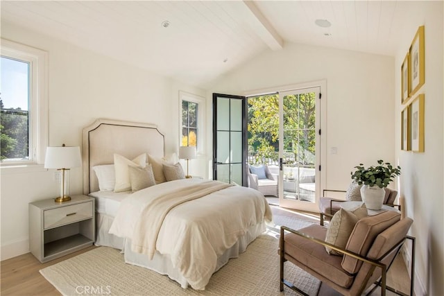 bedroom with light wood-type flooring, access to outside, and multiple windows