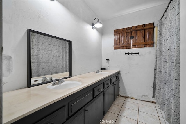 bathroom featuring tile patterned flooring and vanity