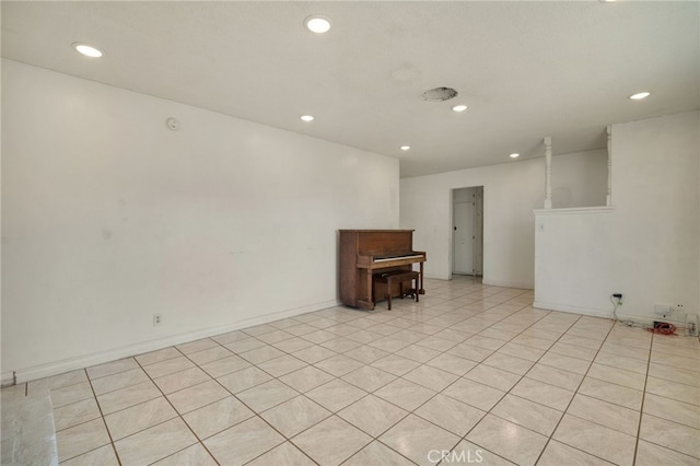 unfurnished room with light tile patterned floors