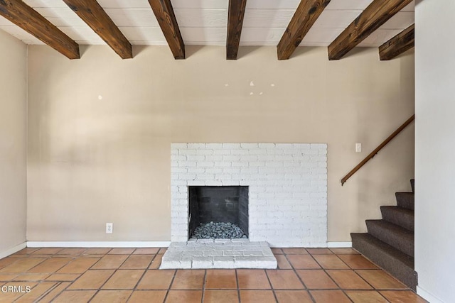 details with a brick fireplace and beamed ceiling