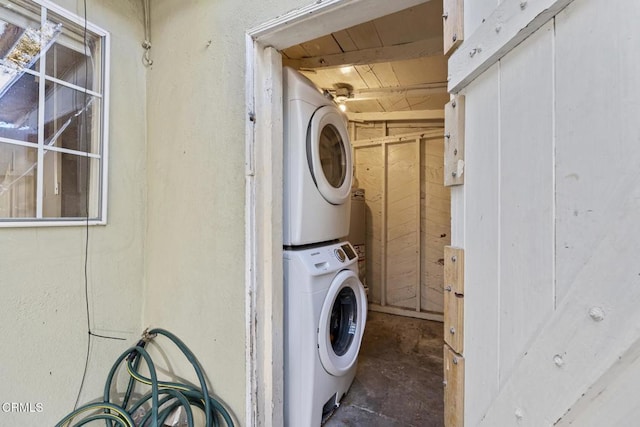 laundry room featuring stacked washing maching and dryer