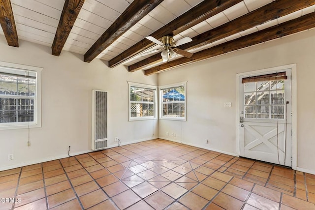 spare room with ceiling fan, light tile patterned flooring, wooden ceiling, and beamed ceiling