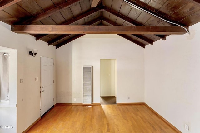 unfurnished living room featuring wood ceiling, light hardwood / wood-style flooring, and lofted ceiling with beams