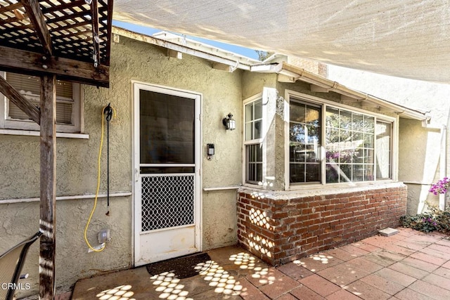 property entrance with a patio area