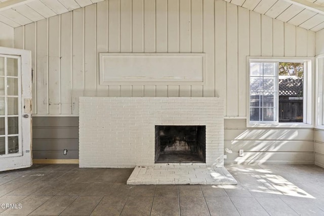 interior space featuring lofted ceiling and a fireplace