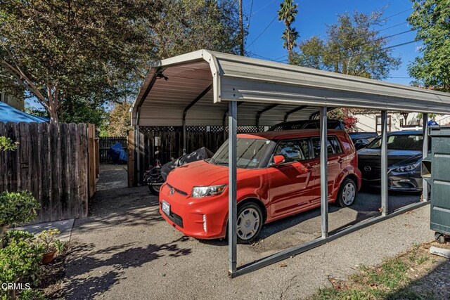 view of parking / parking lot with a carport