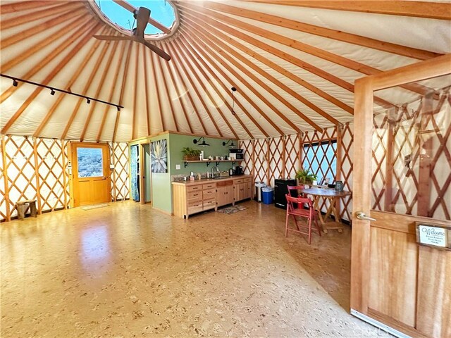 interior space featuring sink and vaulted ceiling