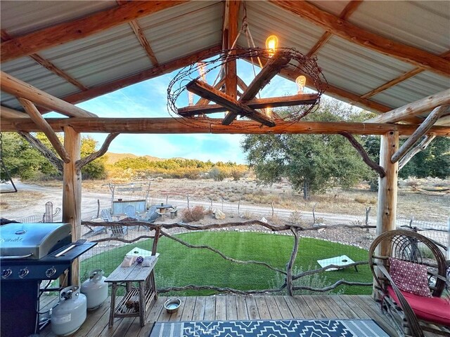 wooden terrace with a mountain view and area for grilling