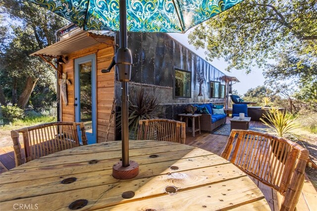 wooden deck with an outdoor hangout area