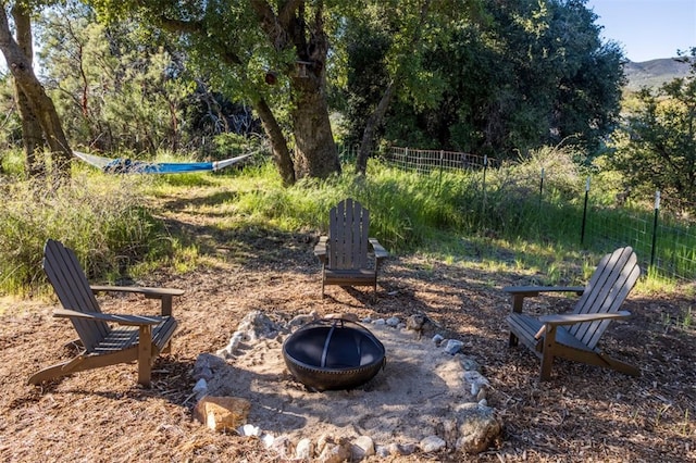 30415 Chihuahua Valley Rd, Warner Springs, CA 92086 - view of yard featuring an outdoor fire pit, a mountain view, and fence