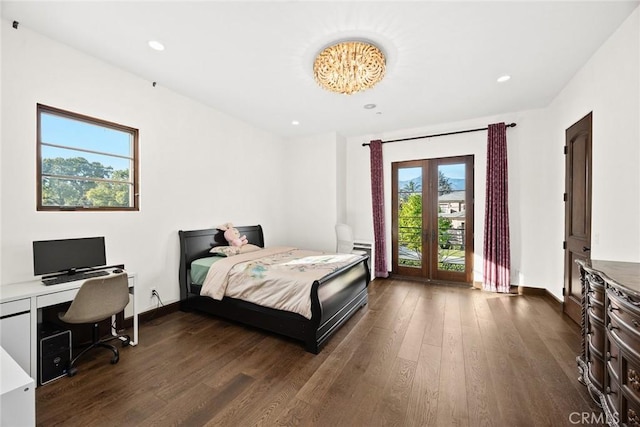 bedroom with dark hardwood / wood-style floors and access to outside