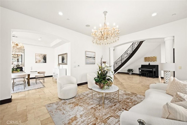 living room featuring a notable chandelier