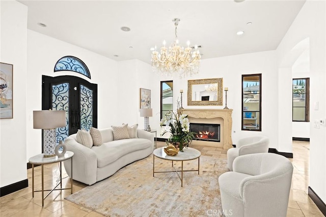 tiled living room featuring a chandelier