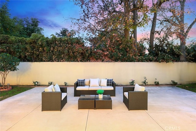 patio terrace at dusk with an outdoor living space