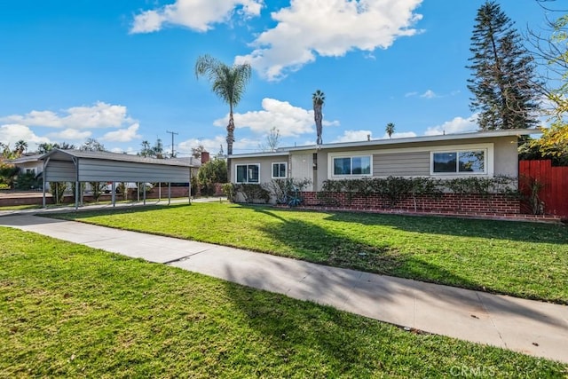 single story home with a carport and a front lawn