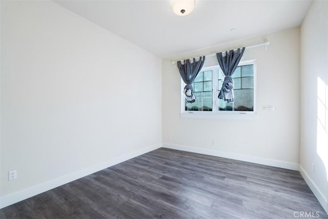 empty room featuring dark hardwood / wood-style floors