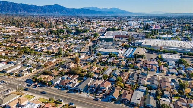 birds eye view of property featuring a mountain view