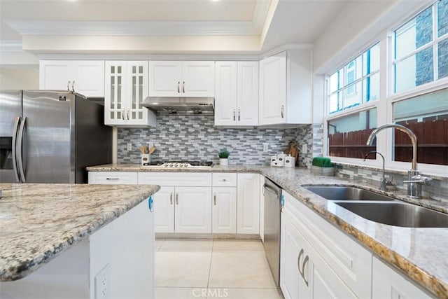 kitchen featuring sink, stainless steel appliances, light stone counters, crown molding, and white cabinets