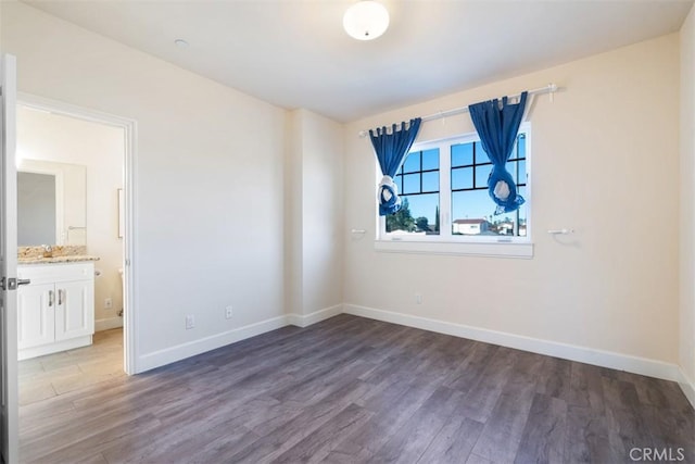 unfurnished room with dark hardwood / wood-style floors