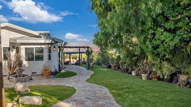 view of yard with a pergola and a patio