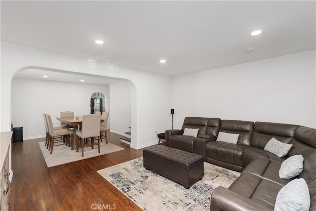 living room with dark hardwood / wood-style flooring