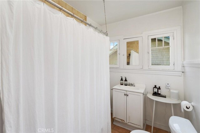 bathroom with vanity and toilet