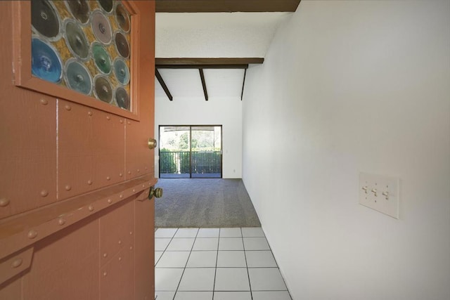 corridor with lofted ceiling with beams and light carpet