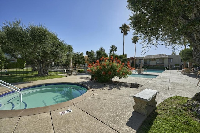 view of swimming pool featuring a patio