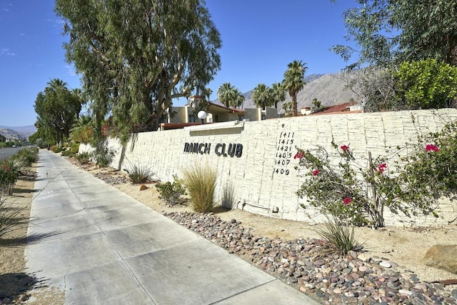 community sign featuring a mountain view