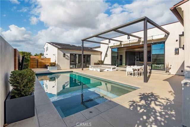 view of pool with an outdoor living space, a patio area, and an in ground hot tub