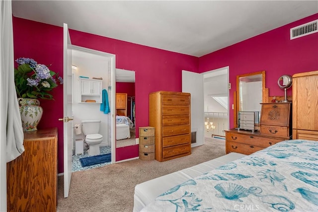 carpeted bedroom featuring connected bathroom