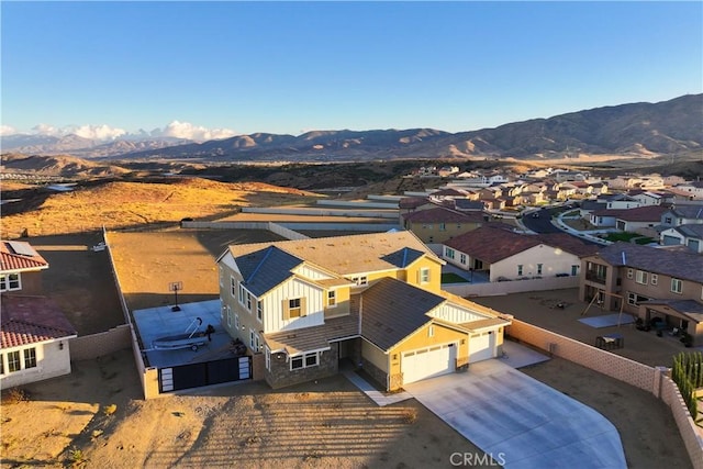 birds eye view of property with a mountain view