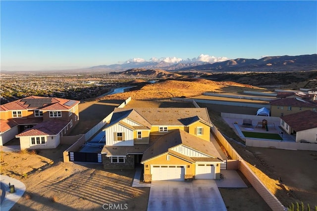 birds eye view of property featuring a mountain view