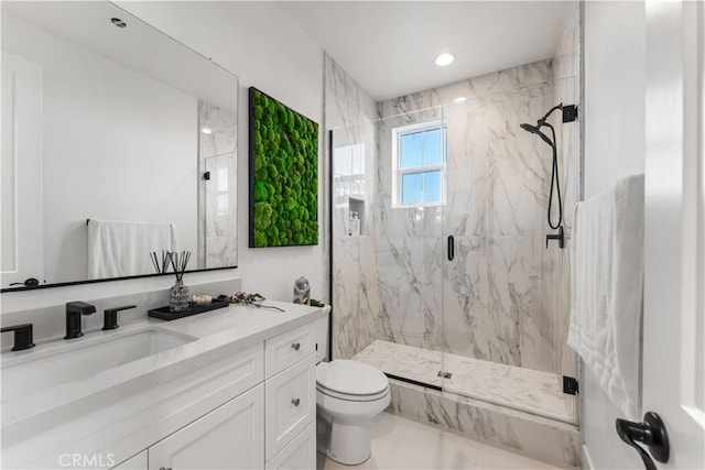 bathroom with vanity, toilet, and walk in shower