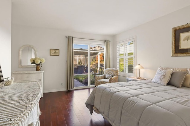 bedroom featuring access to outside and dark wood-type flooring