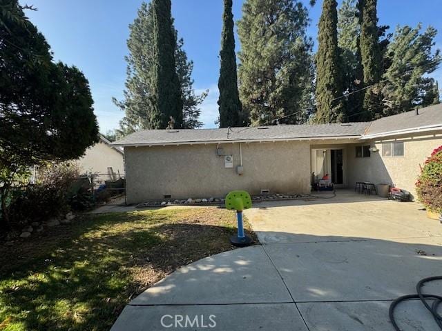 rear view of property with a patio area