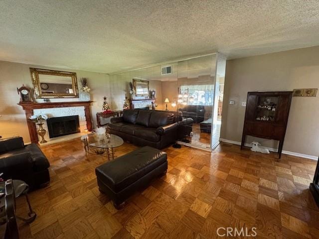 living room featuring a textured ceiling