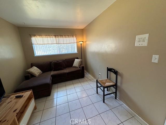 living room featuring light tile patterned flooring