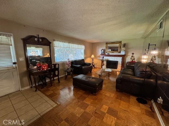 living room with a textured ceiling