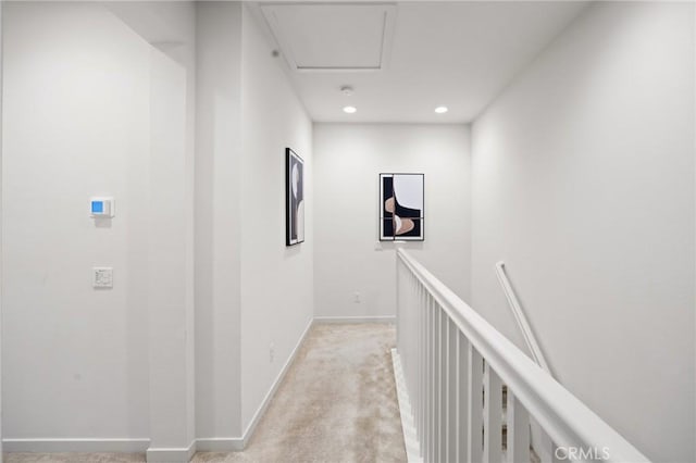 corridor with light colored carpet