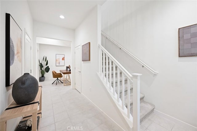 stairs featuring tile patterned floors