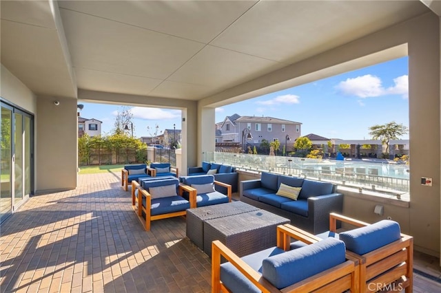 view of patio / terrace featuring a water view and an outdoor hangout area