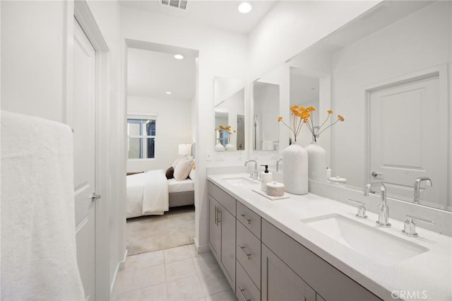 bathroom featuring tile patterned floors and vanity