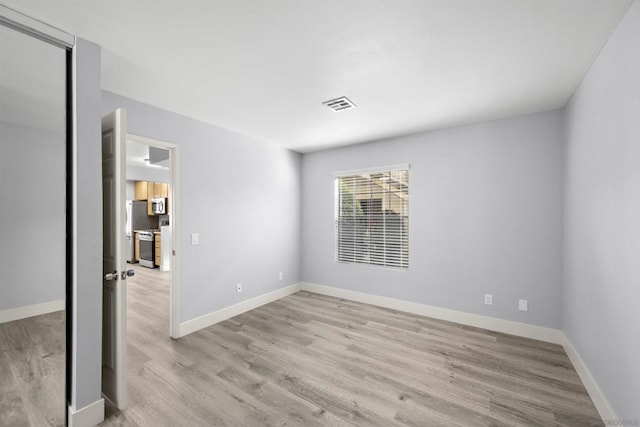 empty room featuring light hardwood / wood-style floors