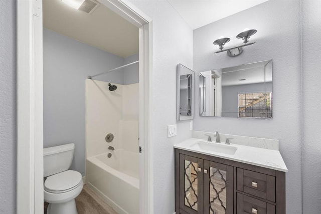 full bathroom with vanity, toilet, and bathtub / shower combination