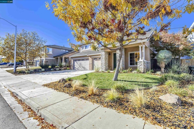 view of front of home with a front lawn and a garage