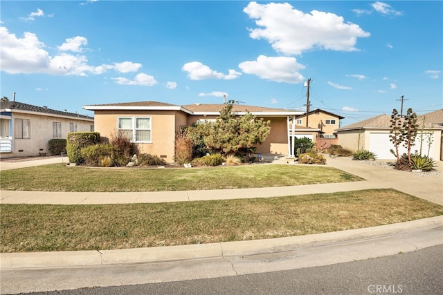 single story home with an outdoor structure and a front lawn