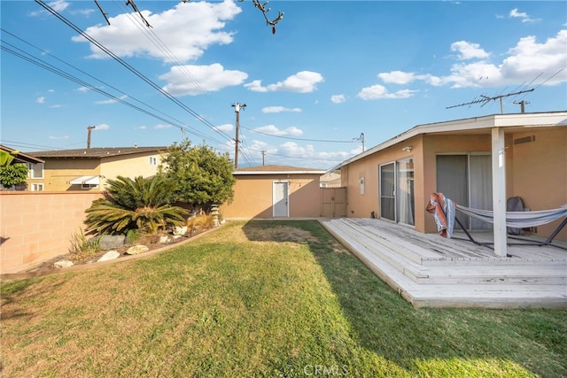 view of yard featuring a wooden deck